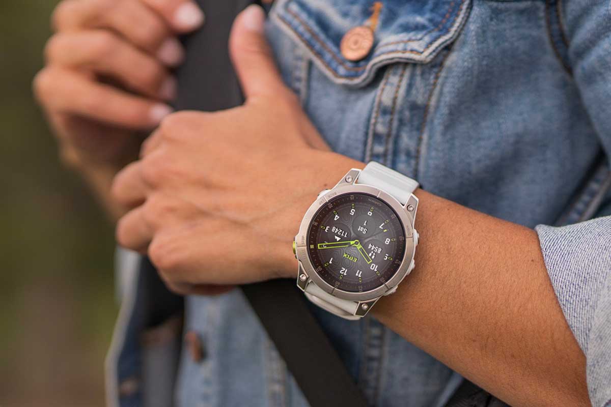 Woman in denim jacket wearing a smartwatch